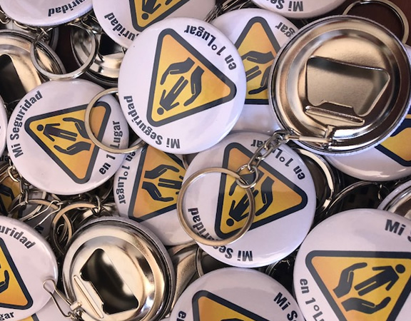 chapitas llavero destapador para campaña de seguridad